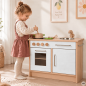 Preview: Kind spielt an Holz Kinderküche für Kita in Weiß-Natur – kindgerechtes Rollenspiel mit Herd und Spüle