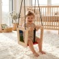 Preview: Kleinkind sitzt in Holz Babyschaukel und schaukelt im Kinderzimmer