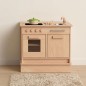 Preview: Kinderküchenblock aus Holz mit Spüle, Backofen und Waschmaschinenmodul in einem hellen Kinderzimmer