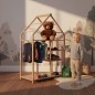 Preview: Kind hängt Kleidung in Montessori Kleiderschrank aus Buche ein, helles Kinderzimmer mit warmem Tageslicht und natürlichem Montessori-Stil.