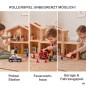 Preview: Kind spielt an einem Holzpuppenhaus mit angebauter Garage, rotem Auto und eingerichteten Zimmern