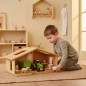 Preview: Hochwertiges Puppenhaus Elsa aus Massivholz Buche. Kind entdeckt begeistert neue Spielwelten.