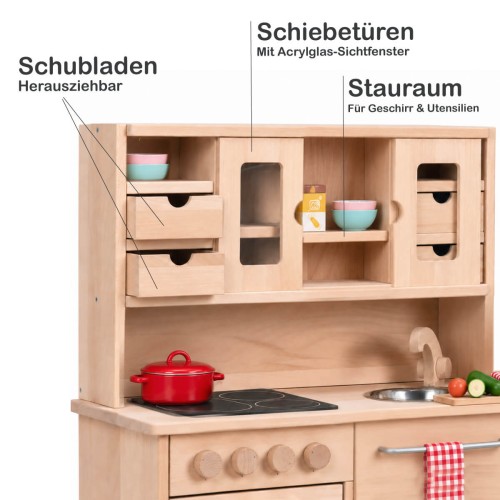 Holz Kinderküche HÄNSEL im Detail mit herausziehbaren Schubladen, Schiebetüren mit Acrylglasfenstern und Stauraum.