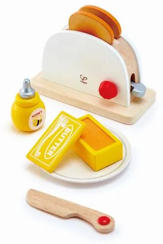 Toaster-Set mit je zwei Toastscheiben, Butter, Honig, einem Teller und ein Holz-Messer.