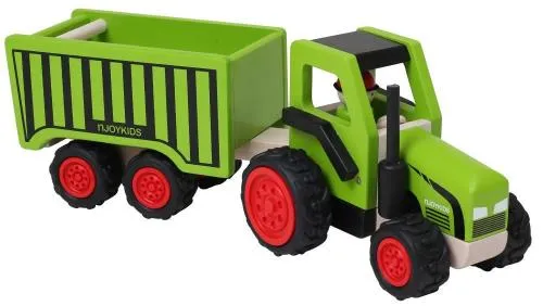 Spielzeugtraktor mit angehangenem Ladewagen.