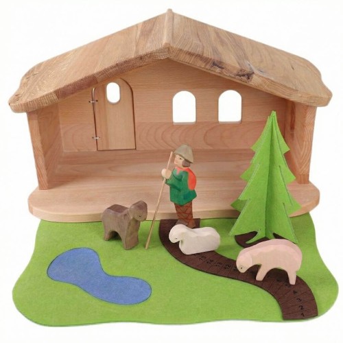 Hirte mit Schafherde auf Adventsweg vor Weihnachtskrippe