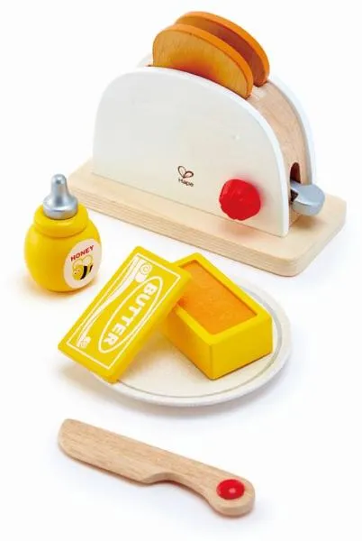 Toaster-Set mit je zwei Toastscheiben, Butter, Honig, einem Teller und ein Holz-Messer.