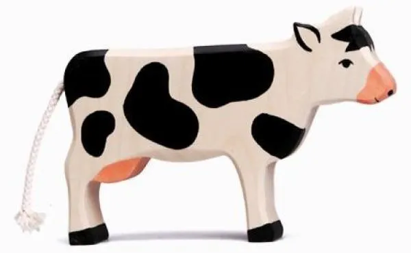 Ochse/Kuh von Holztiger stehend, schwarz-weiß